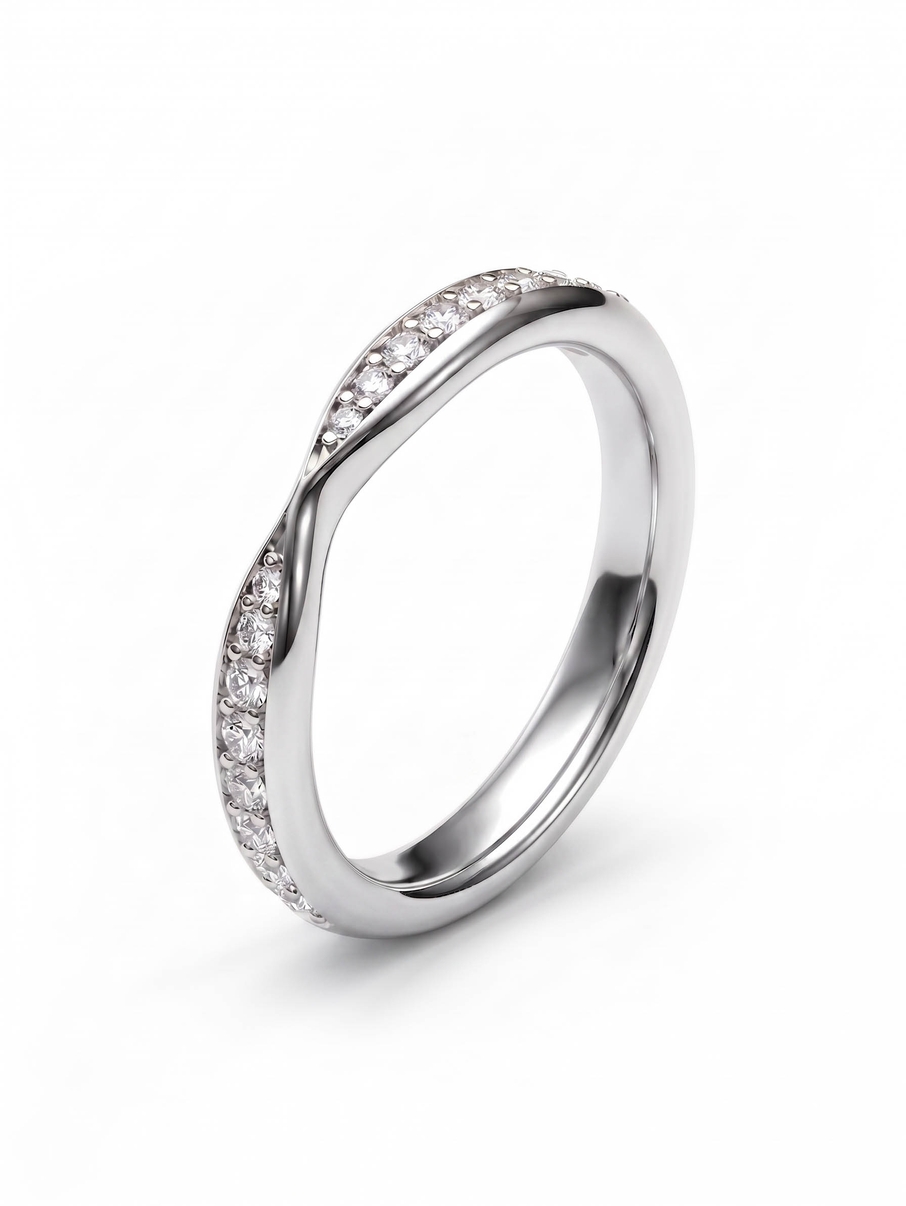 Dámský snubní prsten z bílého zlata se zúžením uprostřed a diamaty po obvodu
