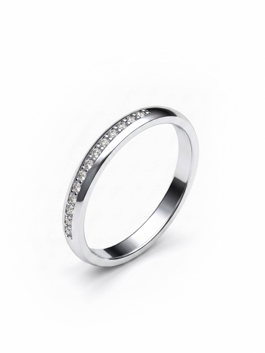Dámský snubní prsten z bílého zlata s kameny v první polovině šíny